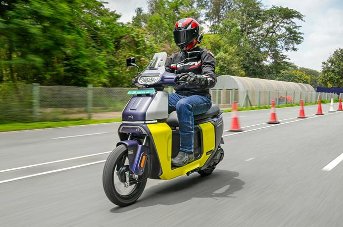 TVS Orbiter review: Different yet familiar TVS Orbiter front left side riding shot on track