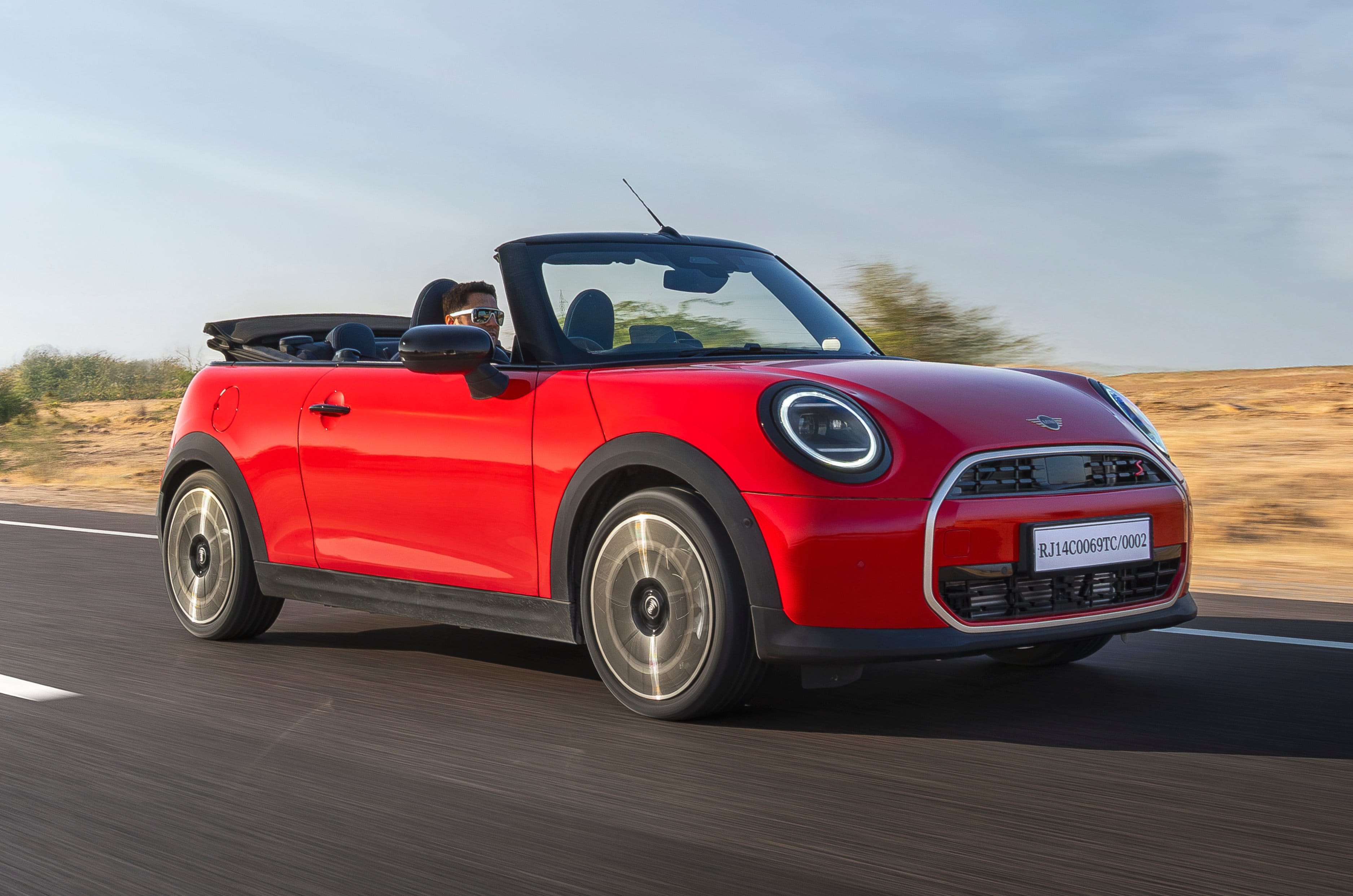Mini Convertible front right side on road driving