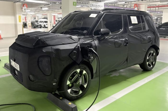 Kia Syros EV spied front charging