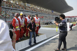 Pit marshals strike a pose for the camera.