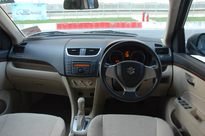 Cabin design is identical to the Swift’s though the use of beige plastics on the lower portion of the dashboard and door pads enhance the ambience inside.