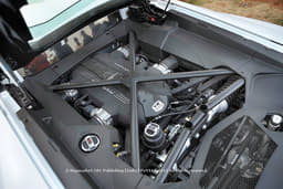 Brace for it when the V12 crosses 6000rpm. Also note race car like pushrod suspension