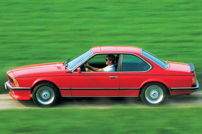 M6s can be distinguished from other E24 models by a larger air dam, M6 badges on the grille and back, and a subtle spoiler.