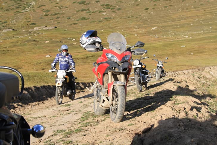 Mucking around on the bikes on the meadows of Sural after camp has been set