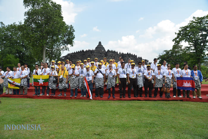 Participants pose in front of Borobudur, a heritage temple site in Indonesia. 