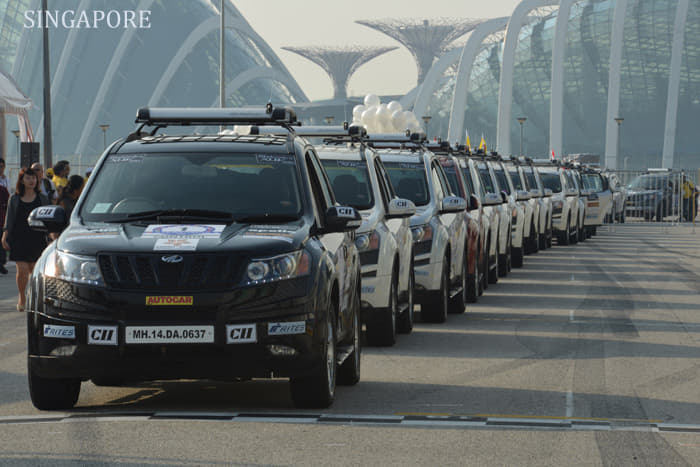 The 31 Mahindra vehicles line up for a flag-off from the F1 Pit at Singapore. 