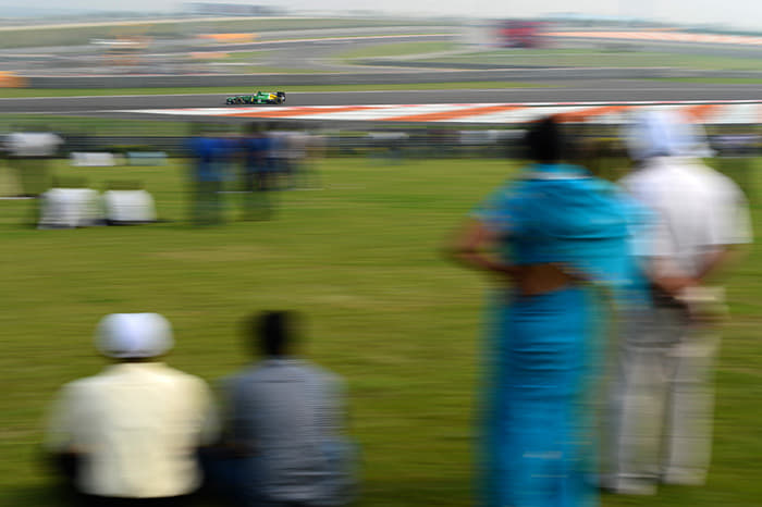 A family enjoying Formula 1 experience from the picnic stand.