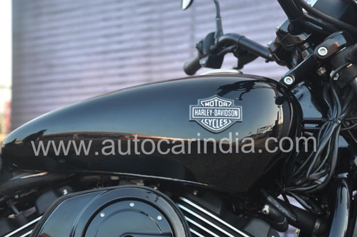 Black metal tank with the Harley-Davidson logo looks iconic. Black metal tank with the Harley-Davidson logo looks iconic.