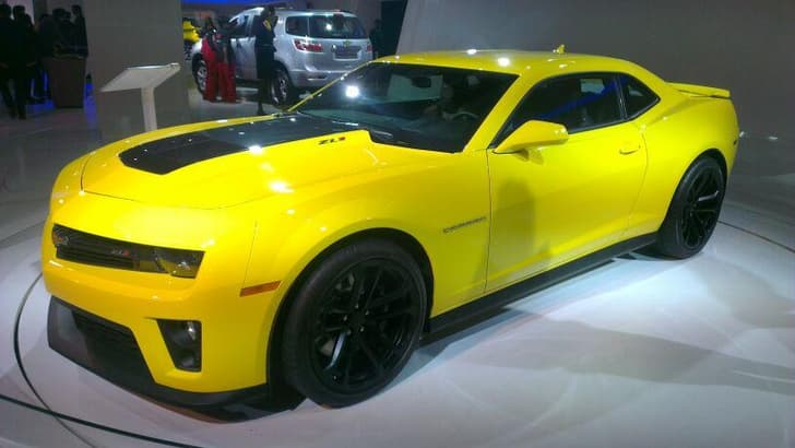 A smashing yellow Chevrolet Camaro is on display at the Chevrolet stall