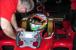 Karthikeyan has the last word with his engineer before going out for the race.