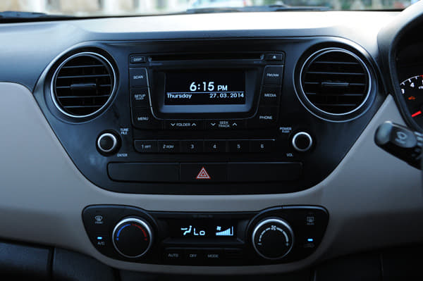 There are small additions to the Xcent’s cabin over the Grand i10’s — the cubbyhole under the centre console gets a closeable lid and it also features automatic climate control. 