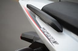 Split grab rails finished in black are provided on either side.
