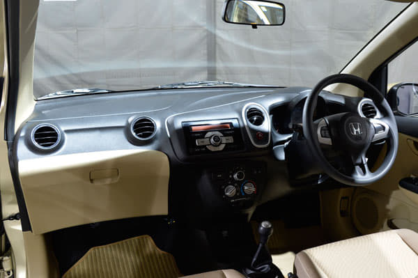 The dashboard is packed close to the windscreen.