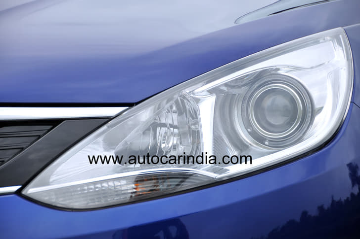 Stretched headlamps look sporty and aggressive. The Zest also gets projector lights.