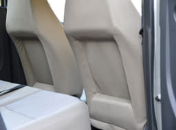 A disadvantage of the scooped-out front seats is that passengers up front can feel the rear person’s knee when it comes in contact with the seat.