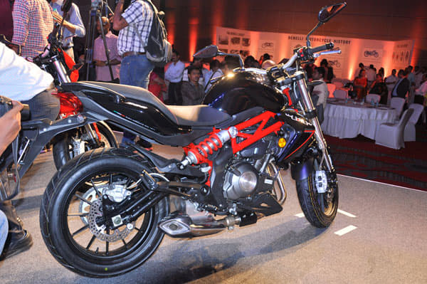 The silencer sits smartly tucked away under the motorcycle engine.