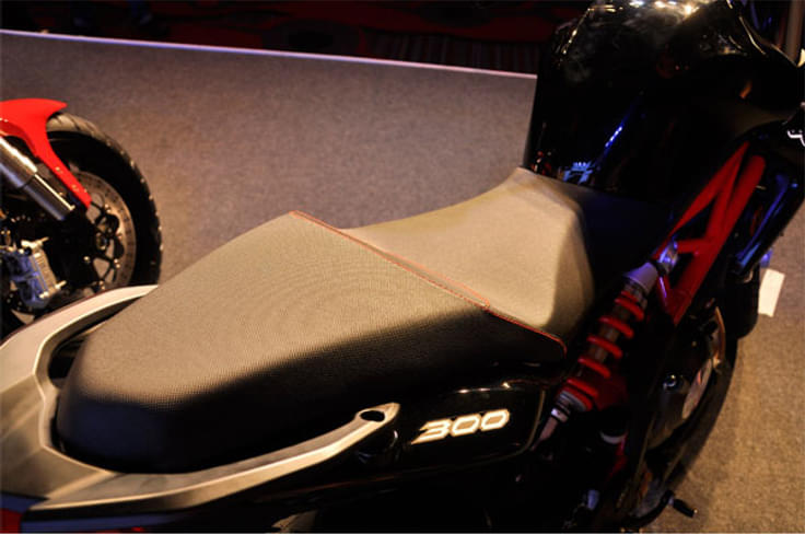 It gets a large stepped-saddle with red stitching. It gets a large stepped-saddle with red stitching.