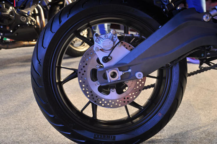Rear disc brake mounted on an alloy section swingarm. Rear disc brake mounted on an alloy section swingarm.