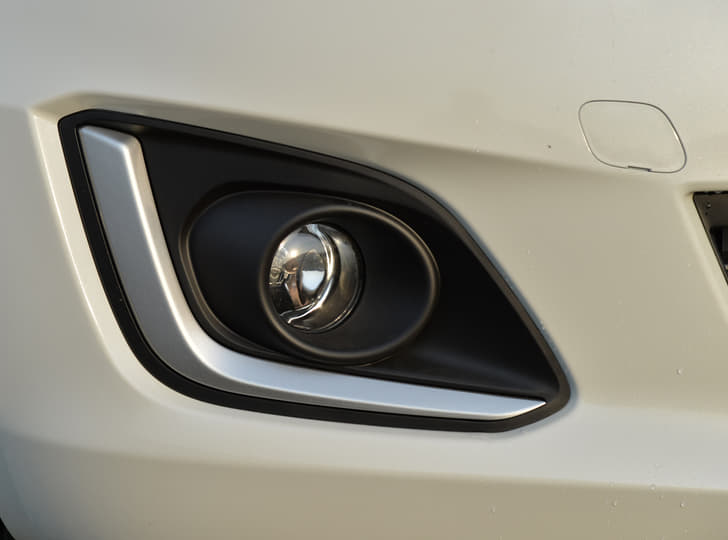 The front bumper gets brushed-aluminum fog-lamp surrounds.