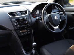 Swift ZXi / ZDi dashboard view along with steering mounted controls for Bluetooth telephony. 