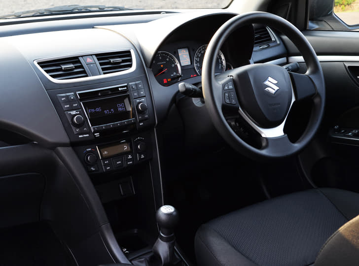 Swift ZXi / ZDi dashboard view along with steering mounted controls for Bluetooth telephony.