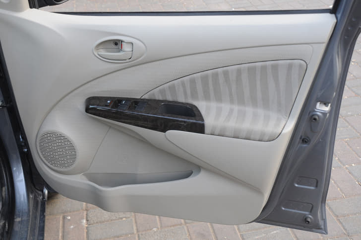 Higher variants get the faux wood trim on inside door handles.