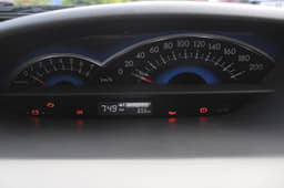 The instrument panel continues to remain at the centre of the dash, now gets digital display with clock. 