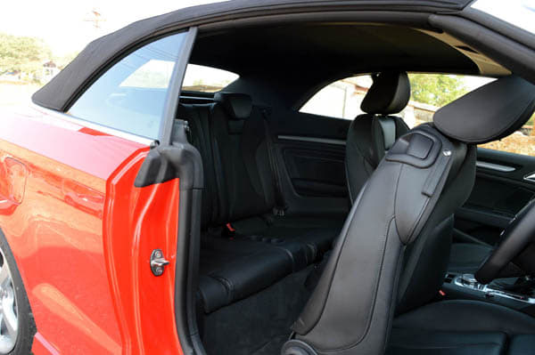 Not a lot of space in the back seats, especially if the driver and front passenger are tall.