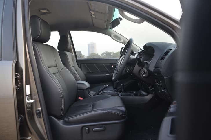 The all-black interior theme continues on the front and rear seats.