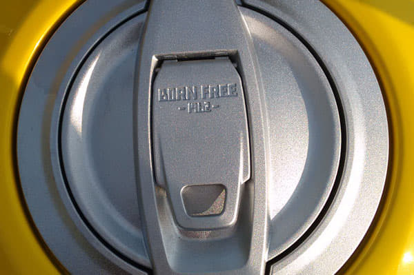 Fuel filler cap has 'BORN FREE - 1962' embedded on.