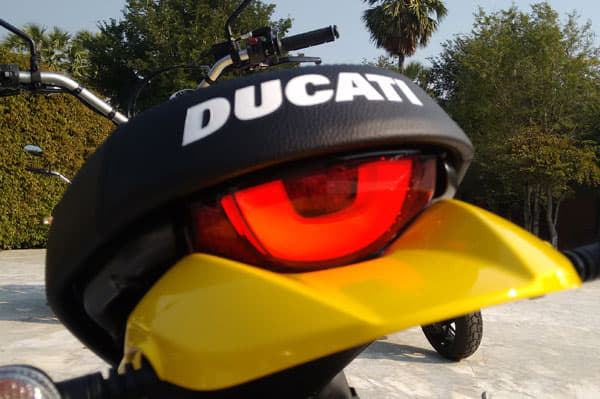 Distinct half-moon taillight with Ducati branding on seat.
