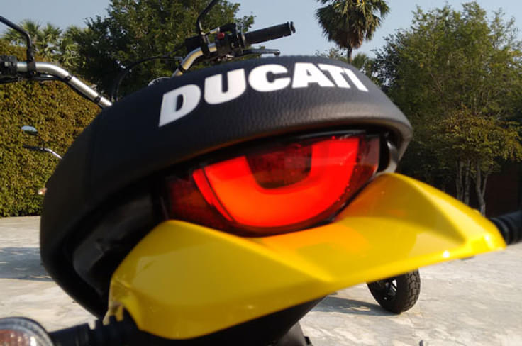 Distinct half-moon taillight with Ducati branding on seat. Distinct half-moon taillight with Ducati branding on seat.