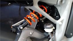 Near horizontal mounted monoshock is adjustable, offered firm ride on the test bike.