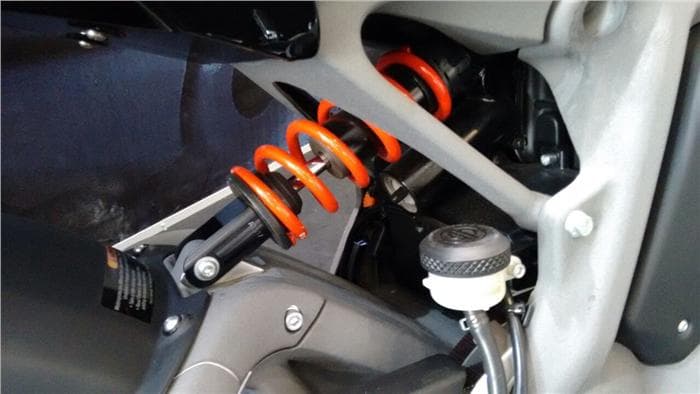 Near horizontal mounted monoshock is adjustable, offered firm ride on the test bike.