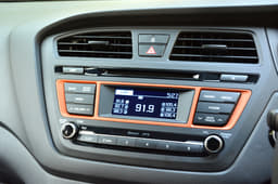 Orange inserts around audio system.