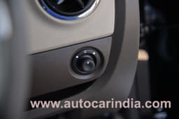 Mirror adjuster on dashboard for easy access.  