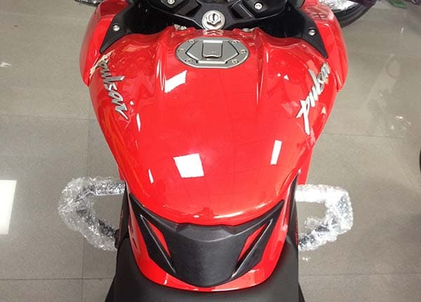 Factory-fitted tank grips on offer; the fuel-tank is derived from the one seen on the Pulsar 200NS. 