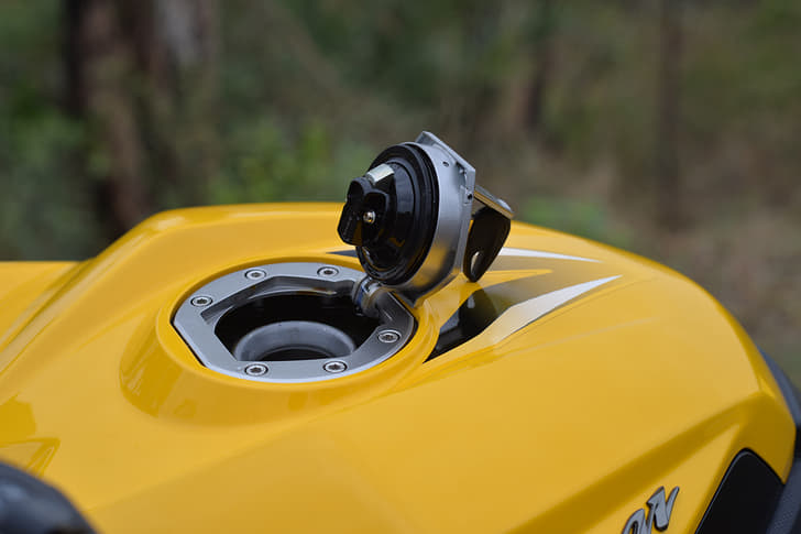 Bajaj provides a hinged fuel cap here.