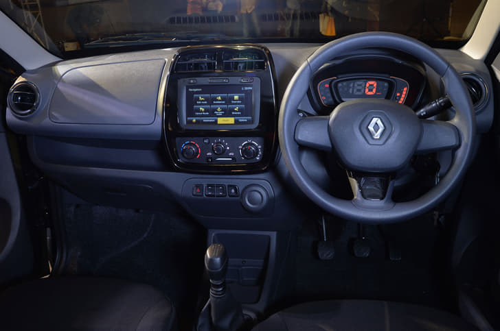 Renault Kwid interior design may be simple, but there are loads of nice details, like the piano black and chrome centre console.