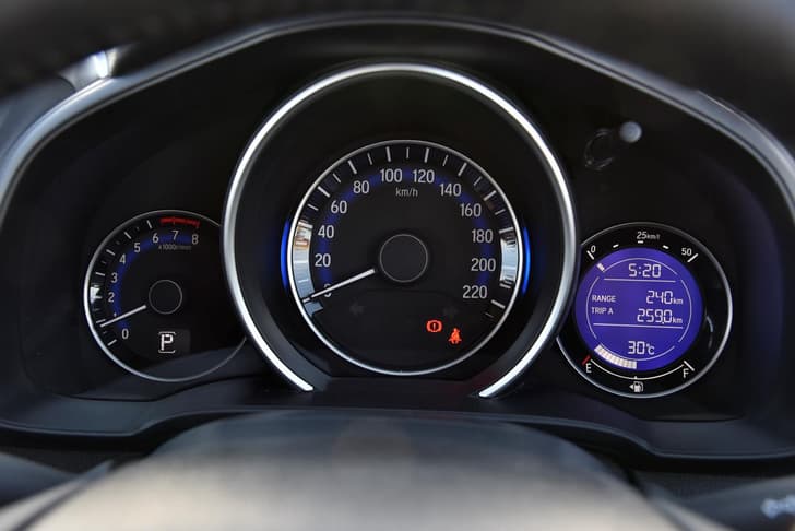 The instrument cluster and fonts are laid out like in the City, but the hood over the speedo adds a bit of flavour to the rather simple look.