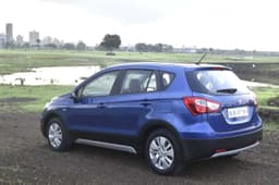 The S-Cross gets black body cladding and faux skid plates all around to give it the crossover look.