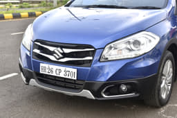 The S-Cross gets a dual-slat chrome grille along with chrome inserts around the fog lamps.
