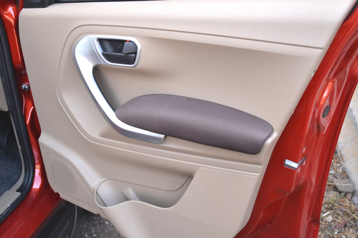 The doors have soft, cushioned arm rests and grab handles that look nice.