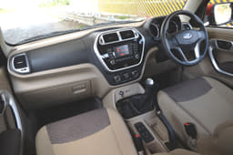 The dashboard puts textures, glossy black and matte silver plastic to good use.