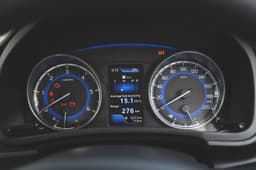 The blue backlight instrument panel stands out in the all-black interior.