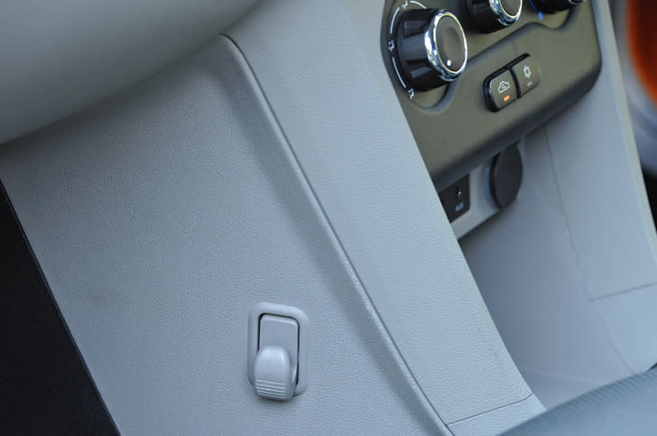 The passenger footwell gets a hook to hang shopping bags.