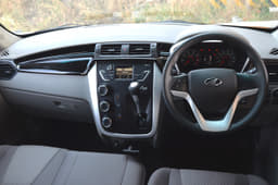 The KUV100’s dashboard looks distinctive with a centre console-mounted gear lever and handbrake, freeing up space for a third seat at the front.