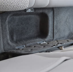 Clever storage box hidden in the floor between the seats. 