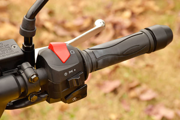 The red button is to activate the hazard warning and is not an engine kill switch.