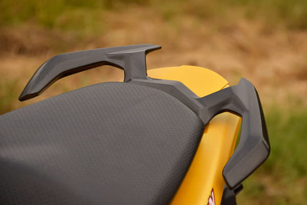 The pillion rider gets split grab handles.